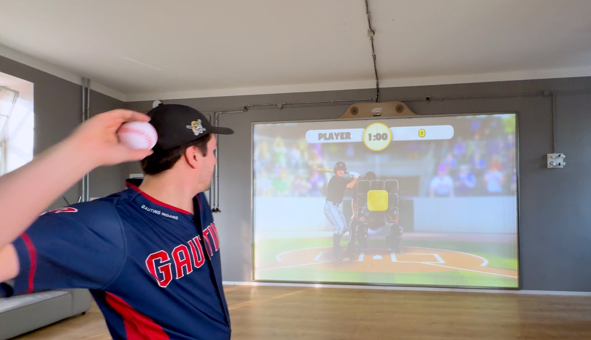 A Baseball Pitcher playing the new arcade challenge game Baseball on the interactive sports wall MultiBall