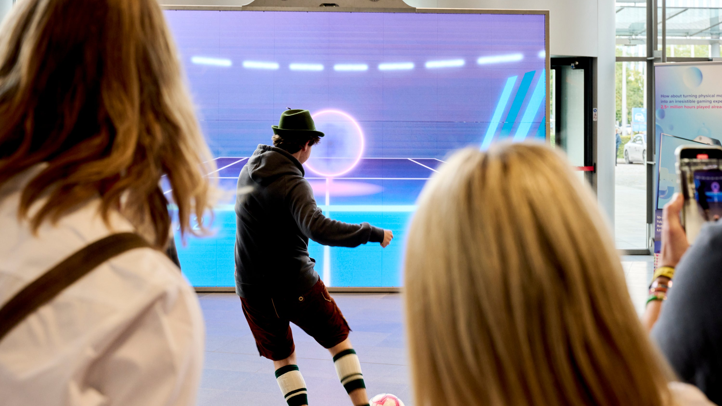 A man playing football on a MultiBall LED system in the training game tennis