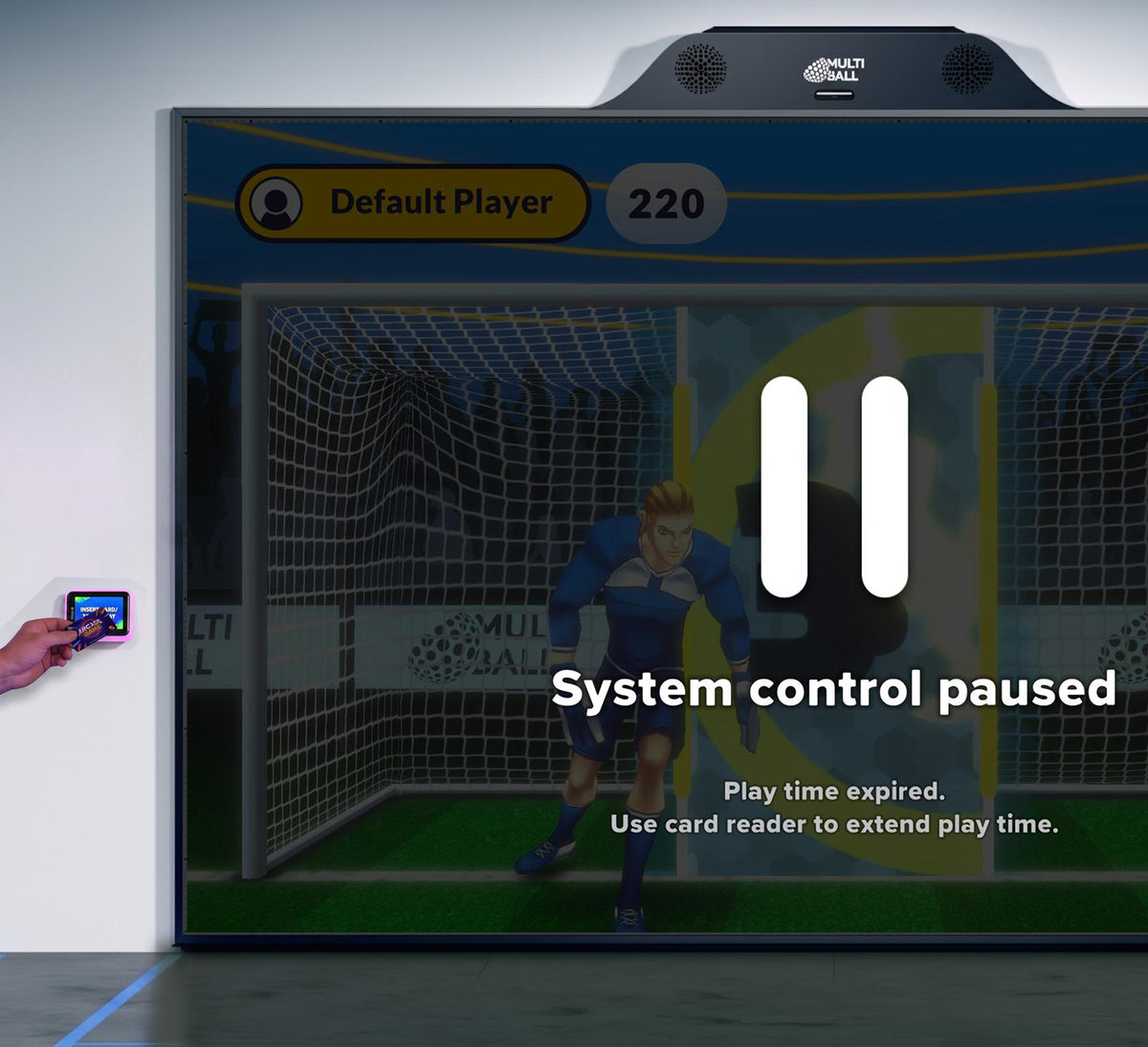 The MultiBall Club system is paused as play time expired with Goal 3D in the background. On the left is a connected card reader for Pay2Play on with a person holding a card in front of the card reader to unlock more play time.