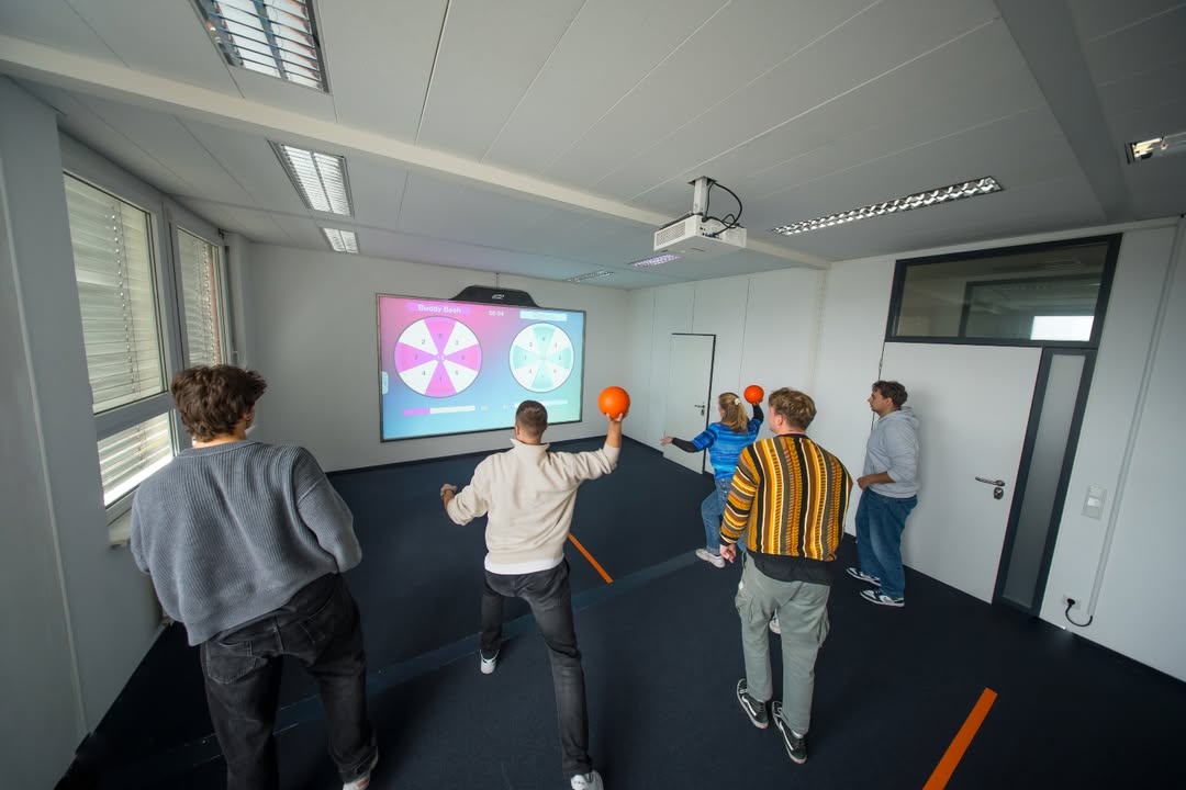 A group of employees playing together at a team event