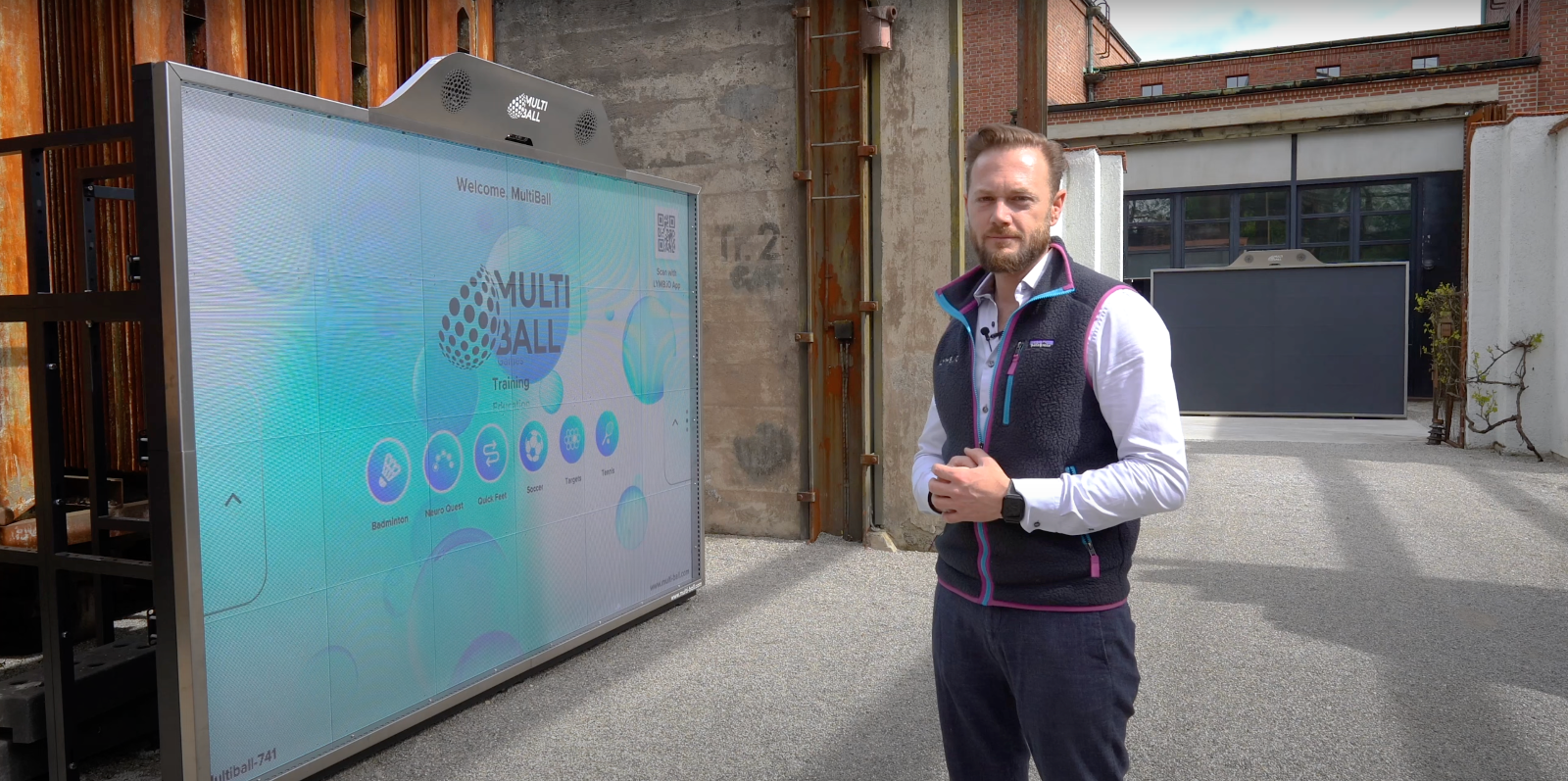 Markos standing outside, next to a MultiBall LED system 