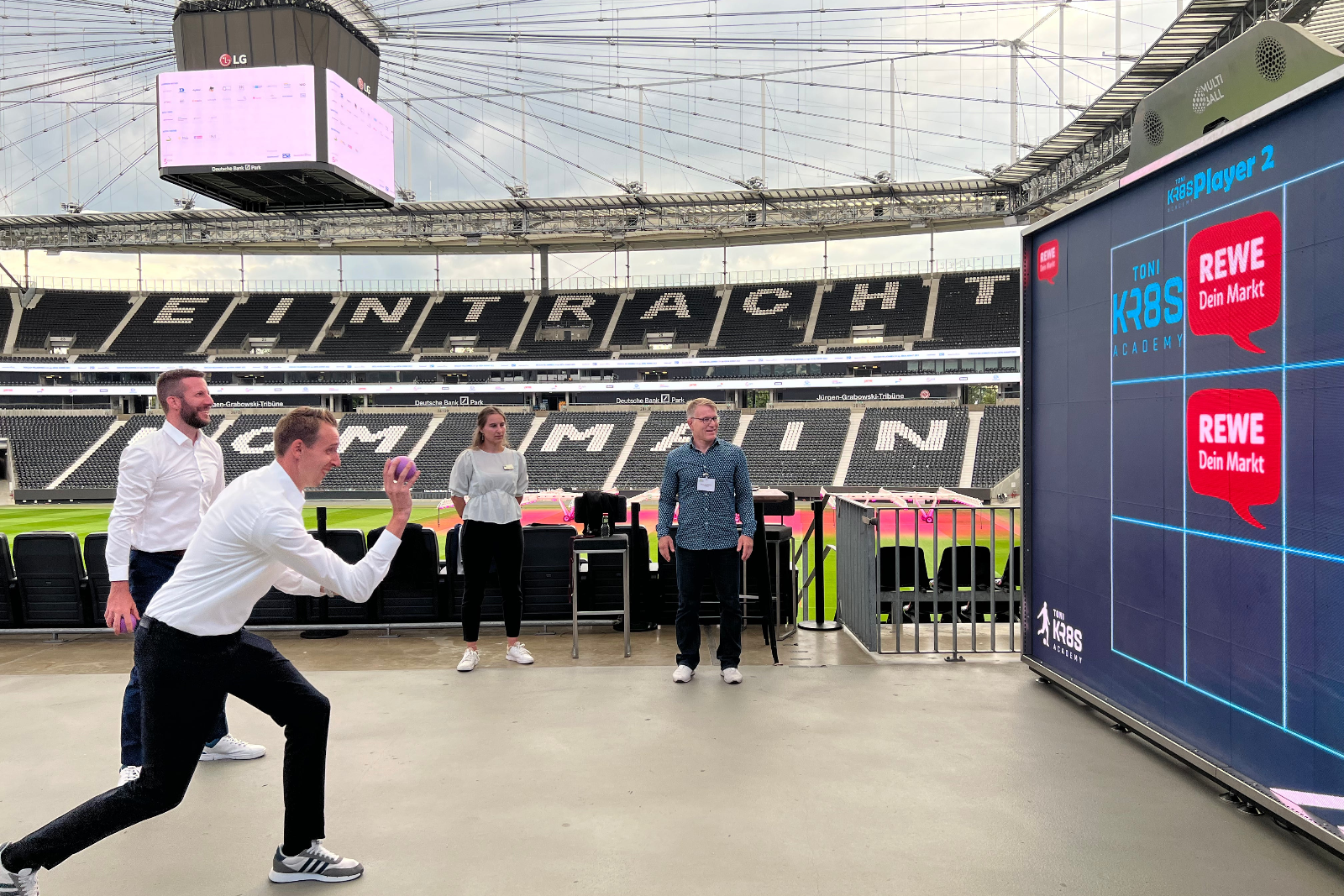 A person playing the customized Tic Tac Toe with REWE and Toni Kroos Academy Logos on the MultiBall LED system in the soccer stadium of Eintracht Frankfurt
