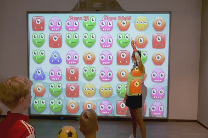 Groups of kids playing different games on the interactive wall MultiBall